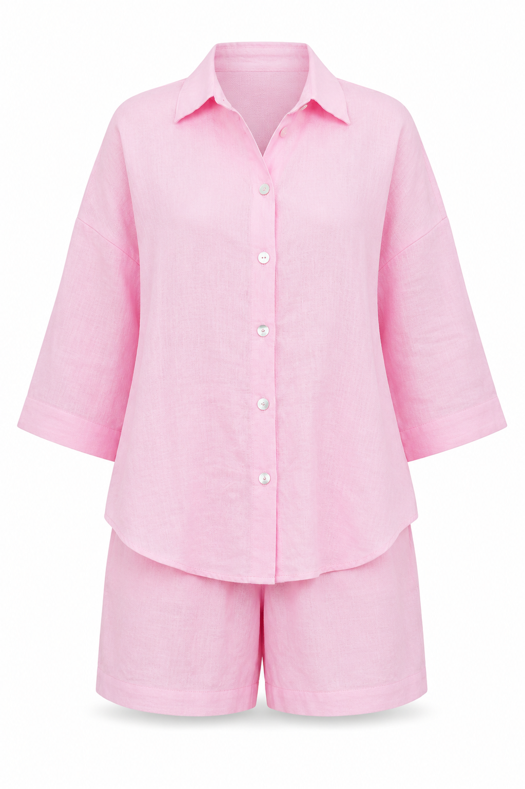 A light pink two-piece pajama set featuring a long-sleeve button-up shirt and matching shorts, displayed on a clean white background.
